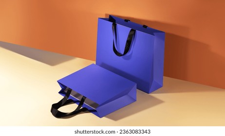 Blue paper shopping bags mockup with black handles on colorful background