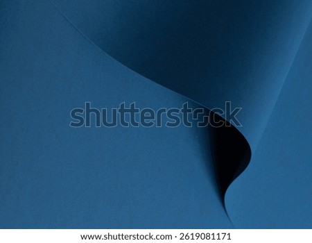 Blue paper texture with deep blue and cobalt tones, smooth matte surface with wavy folds and elegant abstract design, chic and moody finish for a stylish, modern backdrop with rich contrast.