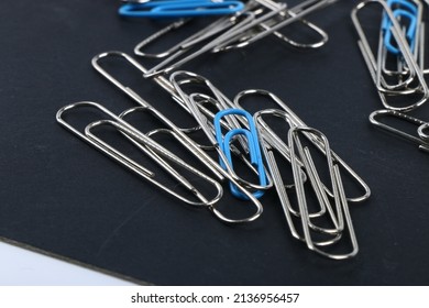Blue paperclip individual . Seperated blue paperclip with silver paperclip
