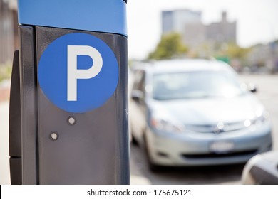 Blue Parking Sign With Blurred Cars At The Background In New York City