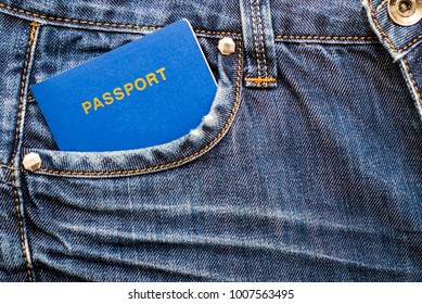 Blue passport in pocket of jeans. Travel concept. Tourist with passport 
