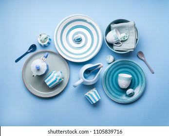Blue pastel ceramic tableware crockery set on abstract background