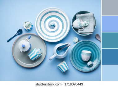 Blue pastel ceramic tableware crockery set on abstract background. Color swatch