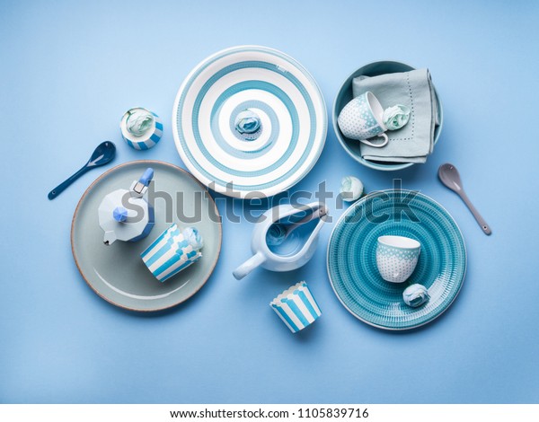 Blue pastel ceramic tableware crockery set on
abstract background
