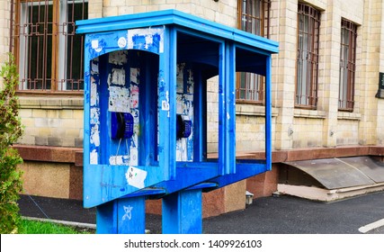 Blue Payphone On The Background Of The Building