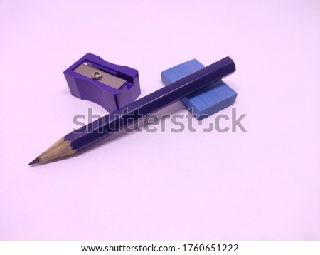 blue pencil with sharpner and eraser isolated in white background