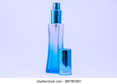 perfume in tall blue bottle