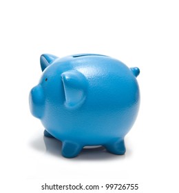 Blue piggy bank or money box isolated on a white studio background.