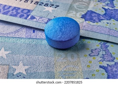 Blue Pill Tablet On Euro Bill Money, Healthcare Concept Macro Photography.