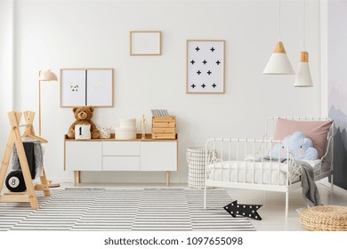 Blue Pillow On White Bed In Scandi Kid's Bedroom Interior With Mockup Of Empty Poster