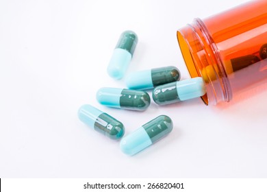 Blue Pills An Pill Bottle On White Background