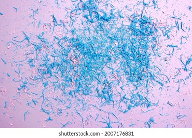 
Blue And Pink Eraser Dust On Colored Background.