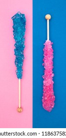 Blue And Pink Rock Candy On A Stick On A White Background