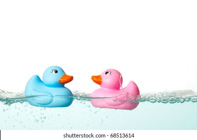 Blue And Pink Rubber Duck In The Water