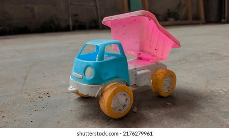 Blue And Pink Toy Truck On The Floor