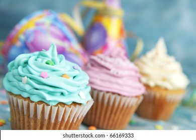 Blue, Pink And White Cup Cake On A Blue Background