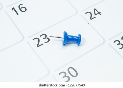 Blue Pins Mark The At 23 On Your Calendar.