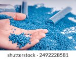 Blue plastic grain, plastic polymer granules,hand hold Polymer pellets, Raw materials for making water pipes, Plastics from petrochemicals and compound extrusion, resin from plant polyethylene.