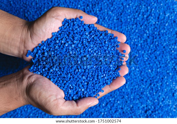 Blue plastic grain, plastic polymer\
granules,hand hold Polymer pellets, Raw materials for making water\
pipes, Plastics from petrochemicals and compound extrusion, resin\
from plant polyethylene.