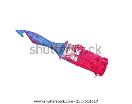 Blue plastic handled brush, paint on the bristles. Isolated on white background.