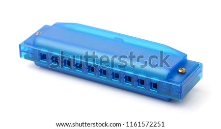 Blue plastic harmonica isolated on white
