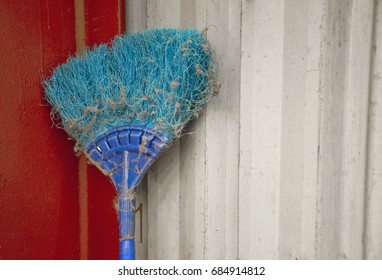 Blue Plastic Sweeper With Full Of Dust And Cobweb Was Kept After Cleaning Factory