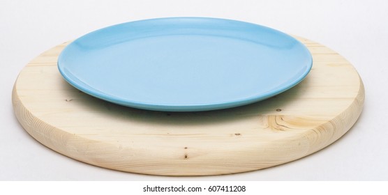 Blue Plate On Round Board White Isolated