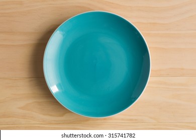 Blue Plate On Wooden Background