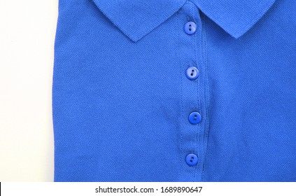 Blue Polo Shirt Close Up View. Casual Plain Polo T-shirt, Button-up Short Sleeve Unisex Clothing Detail With Collar Neck Isolated On White Background	