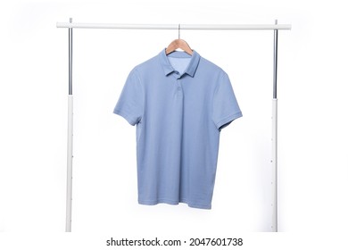 Blue Polo Shirt Mockup On A Wooden Hanger

