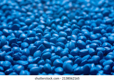 Blue polymer dye in granules, background texture.