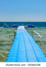 Blue Pontoon On A Sea.