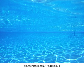 Blue pool underwater light patterns.