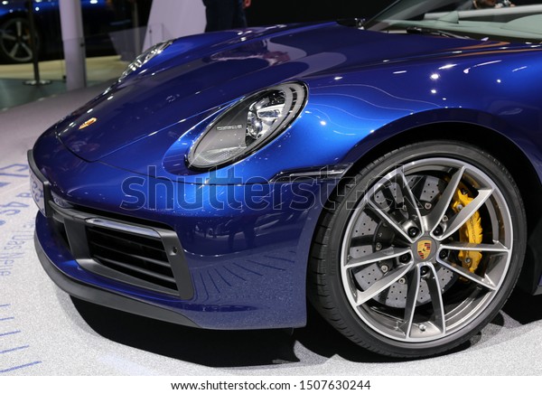 Blue Porsche 911 Carrera 4S Cabriolet in Geneva\
International Motor Show (GIMS), Geneva Switzerland March 2019.\
Iconic 911 had it\'s world premiere as a cabriolet in GIMS 2019. 450\
hp. Color image.