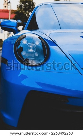 Blue Porsche in Old Town in Vilnius
