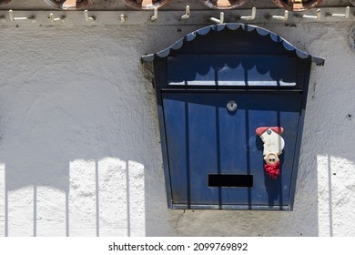 A Blue Post Box Under The Sun