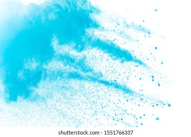 Blue powder explode cloud on black background.Launched blue dust particles splash on background.