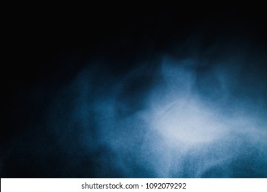   Blue powder explodes on a black background - Shutterstock ID 1092079292
