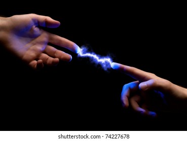 blue powerful electric spark between two fingers of mans hands on black background