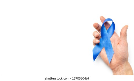 Blue prostate ribbon. Awareness prostate cancer of men health in November. Blue ribbon in hands isolated on white background. November and International Mens Day. - Powered by Shutterstock