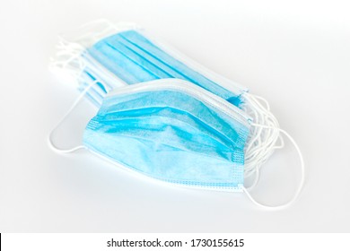 Blue Protective Simple Surgical Mask Unfolded. Many Simple Anti Viral Disposable Face Masks Group, Heap, Object Isolated, Product Shot. Medical Safety Supplies Bulk Buying Concept, Nobody