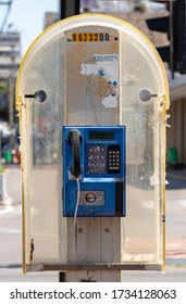 Blue Public Payphone On A City Street