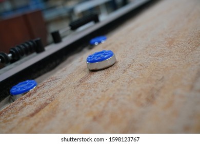 Blue Pucks With Shuffle Board Table Gaming Billboards