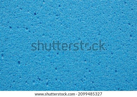 Blue pumice texture, background, macro, close-up, top view. Volcanic pumice stone close-up, background, texture, top view. Porous pumice stone surface, macro, texture, background.