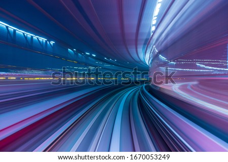 Blue and purple abstract high speed curved movement toward to the future, just around the corner, concept.