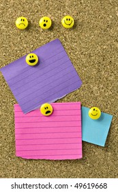 Blue, Purple, And Pink Notes On Corkboard