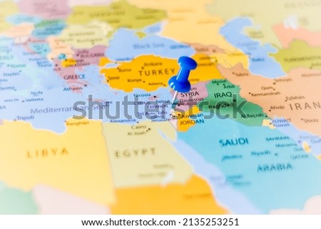 Blue push pin pointing at Beirut, Lebanon on a political world map