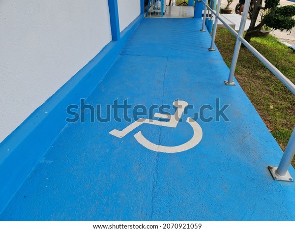 Blue ramps for wheelchair users to access the building\
easily. 