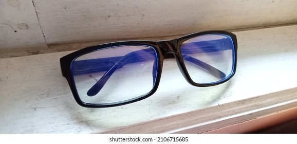 Blue Ray Glasses On White Wood