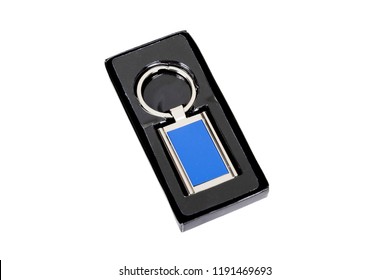 Blue Rectangle Chrome Metal Key Chain In Black Paper Box Isolated On White Background.